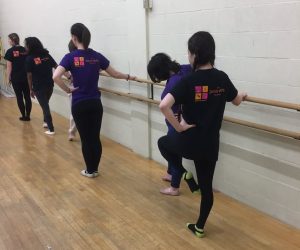 Sandra and dancers at the barre.