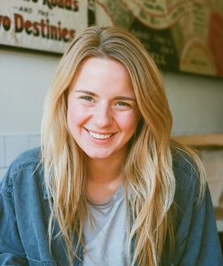 Yound blond women smiling at the camera